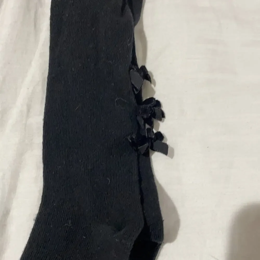 Lili Gaufrette  size 3 tights black and white with back of ankle bows euc